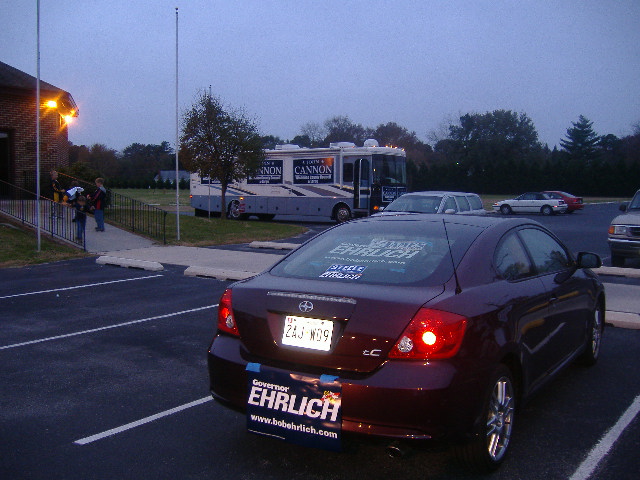 John Cannon's motorhome, which had loudspeakers playing patriotic songs. That's my car in front with its Ehrlich signs.